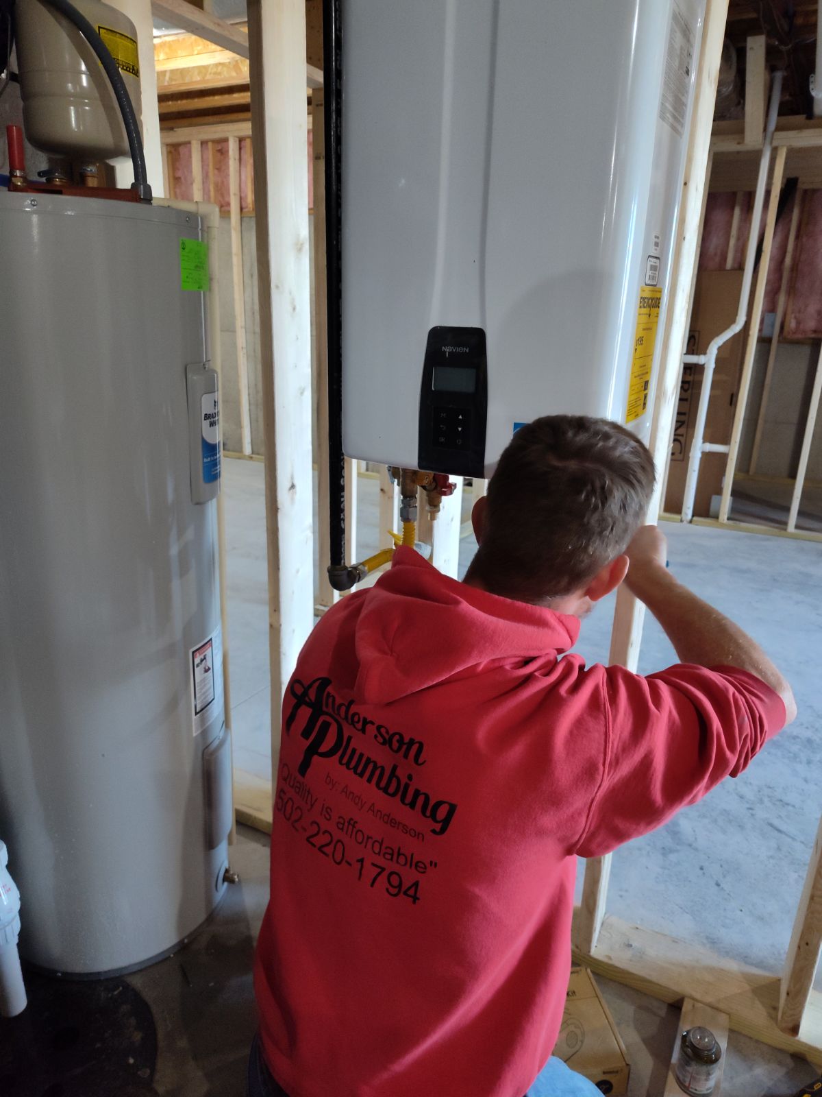 Technician installing tankless water heater