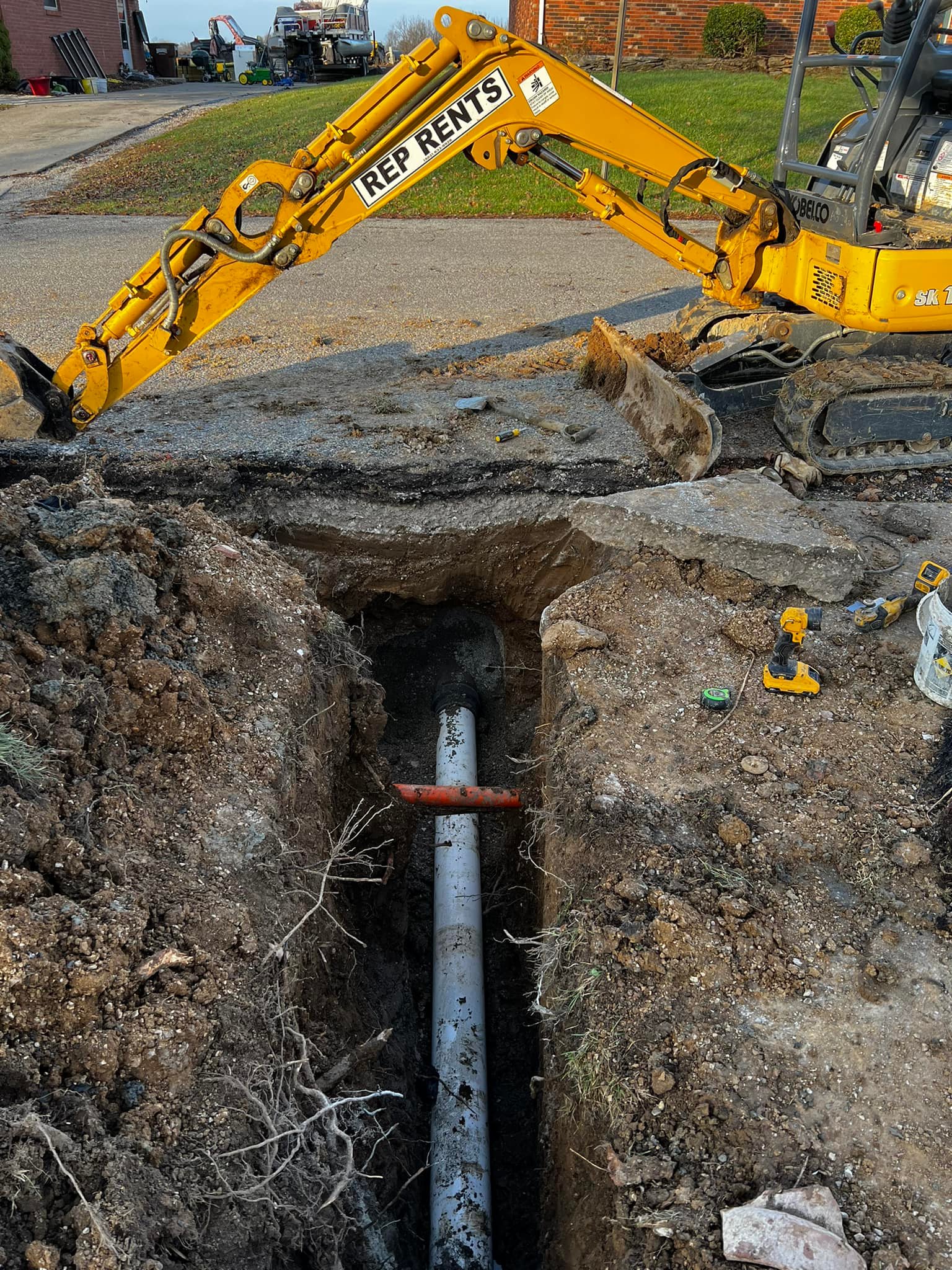 An exposed section of replaced sewer line, where tree roots had invaded the old pipe.