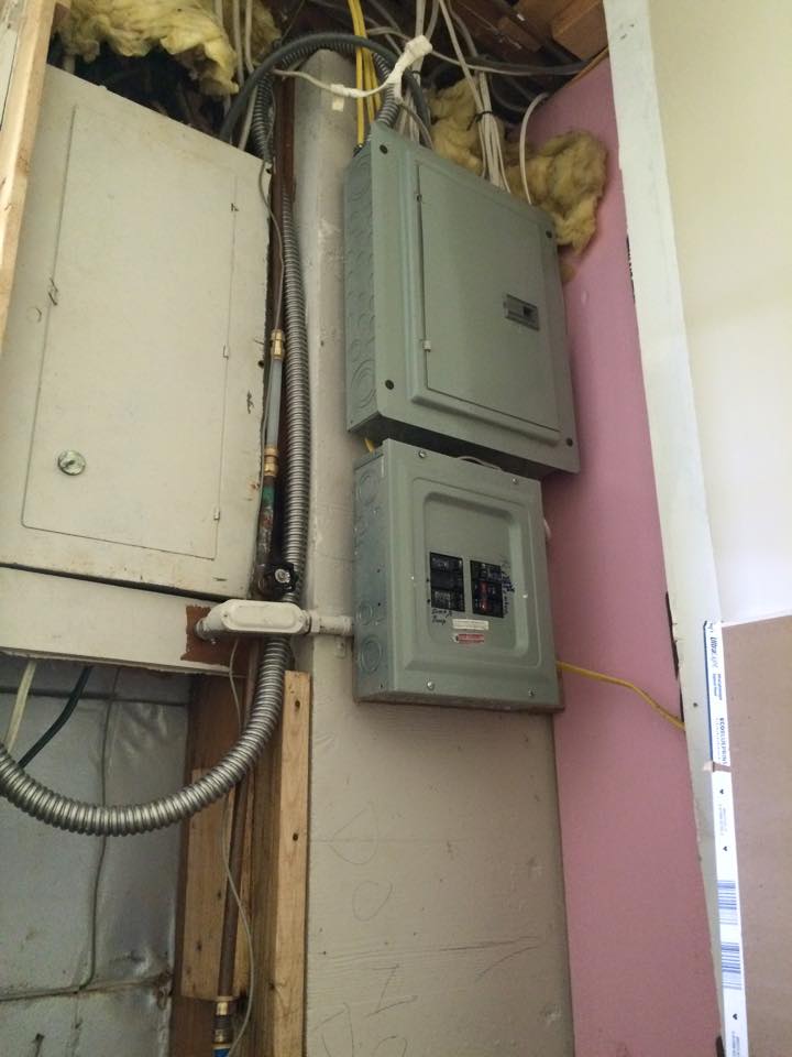 A copper waterline was unsafely installed next to an electric breaker box.